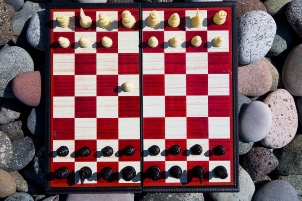 istock White and black pieces are placed on the chessboard, white made the first move. 1356150507