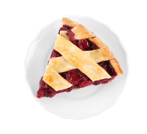 istock Slice of delicious fresh cherry pie isolated on white, top view 1356150616