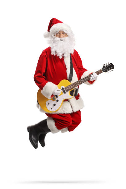 istock Santa claus jumping and playing a yellow electirc guitar 1356150854
