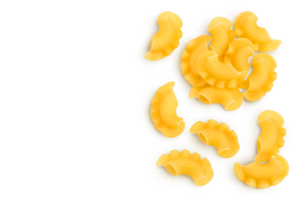 istock Pasta cornetti creste macaroni isolated on white background with clipping path. Top view with copy space for your text. Flat lay 1356154559