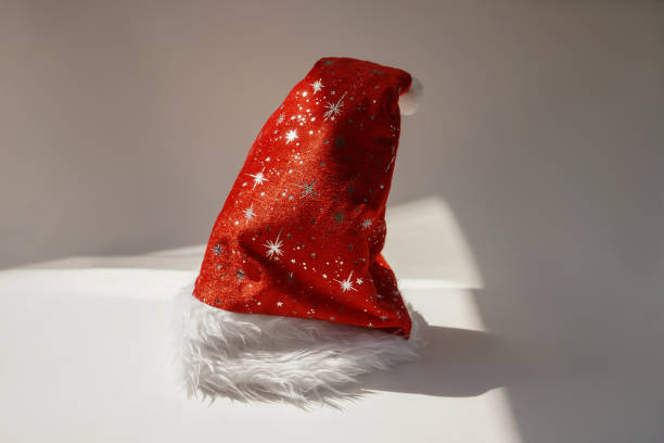 istock Red Santa Claus hat stand on white background. 1356155636