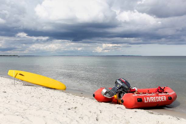 Odder, Denmark - June 22, 2015: Lifeguard on a beach in Denmark. Lifeguard is a rescuer who supervises the safety and rescue of swimmers, surfers