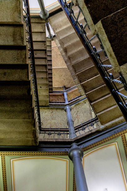 istock stairs in a narrow building 1356156837