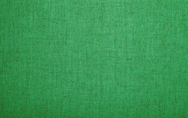 istock Green burlap jute canvas texture background 1356157299