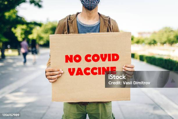 Protester Against The Covid19 Vaccine Stock Photo - Download Image Now - Rebellion, COVID-19 Vaccine, Arguing