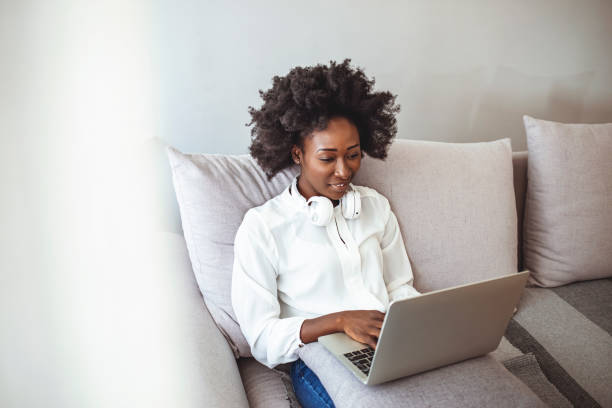 istock A mixed-race woman is using a laptop and working from home. 1356160648