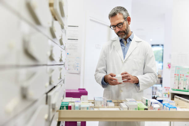 istock A pharmacist storing drugs in the storage room 1356160760