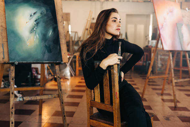 istock Art professional thinking of new ideas in her workshop 1356161450