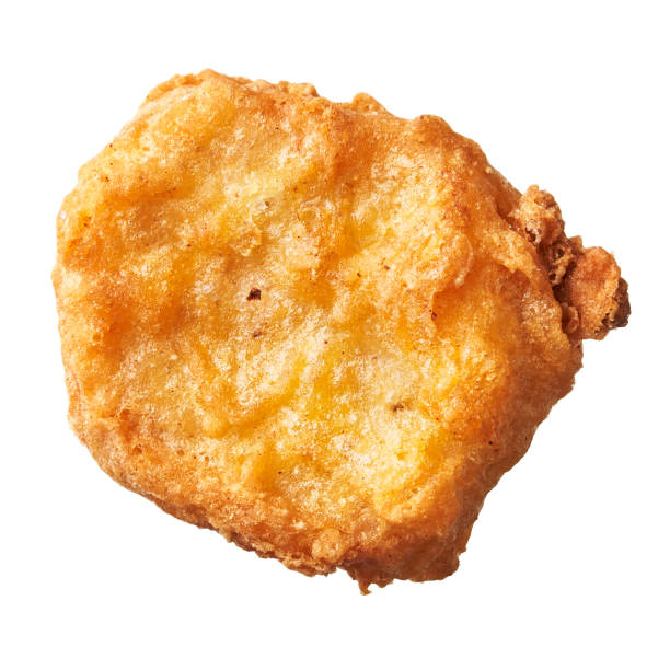 istock SIngle chicken nugget isolated on a white background 1356162380