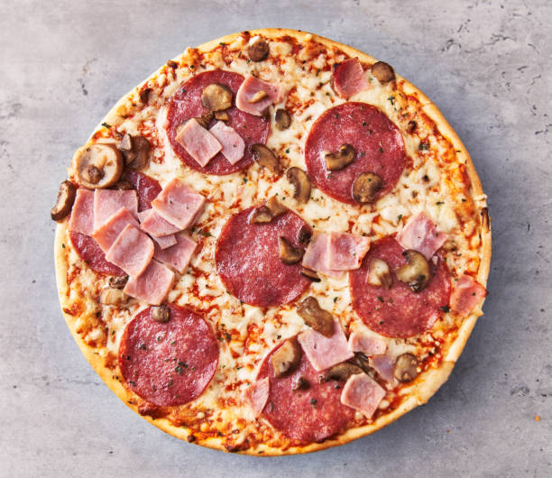 istock Delicious italian pizza on a concrete surface 1356162654