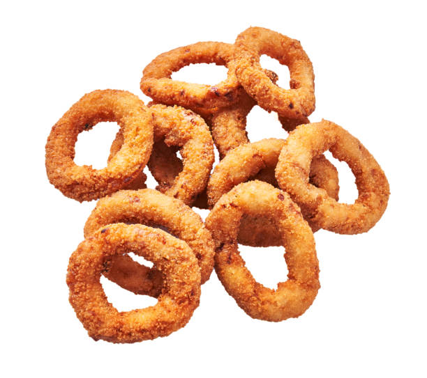 istock Bunch of breaded onion rings isolated on a white background 1356162887