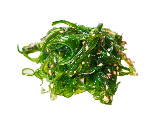 istock Bunch of wakame seaweed isolated on white background 1356163021
