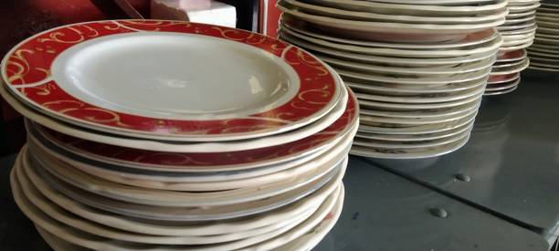 istock pile of white glass plates 1356163049