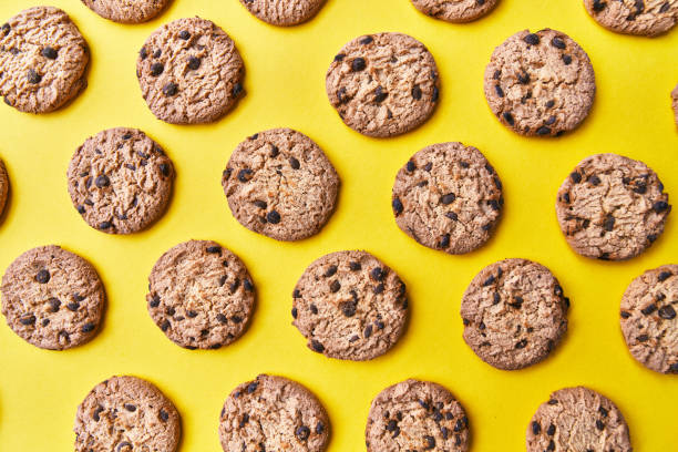 istock Delicious chocolate cookies on a yellow background 1356163203