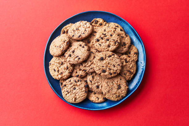 istock Plate of chocolate cookies on a red background 1356163228