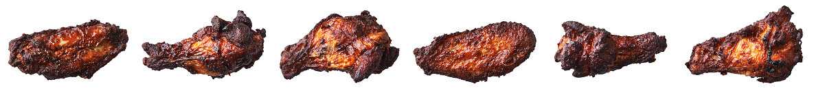 Bunch of roasted chicken wings isolated on a white background