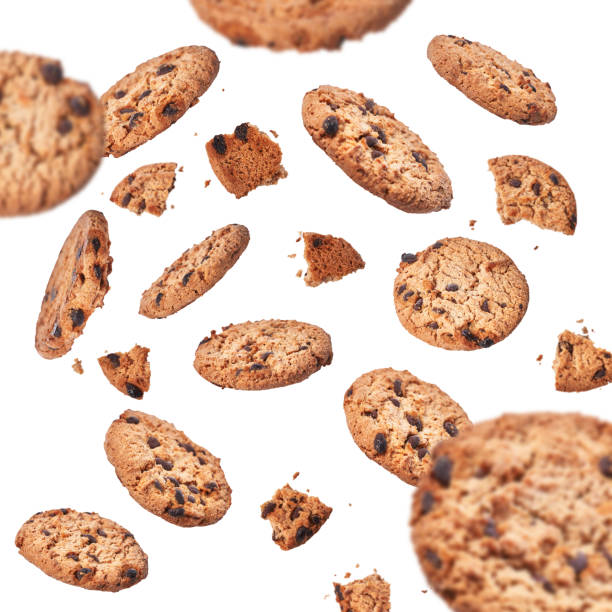 istock Delicious chocolate cookies flying isolated on a white background 1356163397