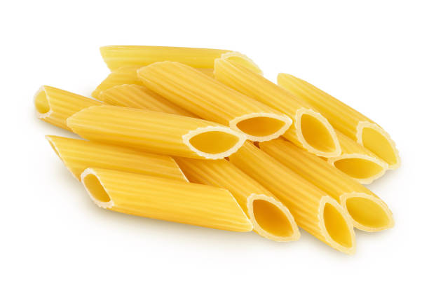 istock Raw italian penne rigate pasta isolated on white background with clipping path and full depth of field 1356164279