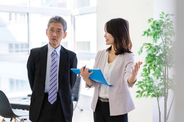 istock VIP having a conversation with his secretary 1356164333