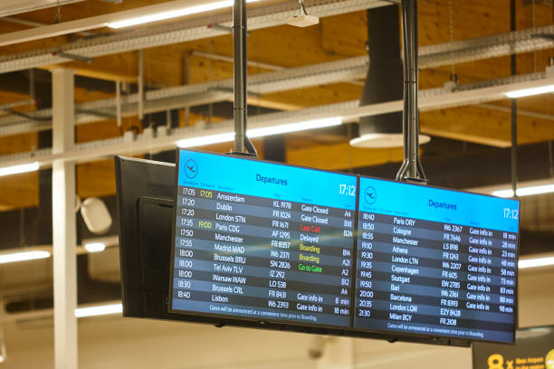 istock Airport boarding gates information displays. Flight schedule. Departure arrival status 1356165643