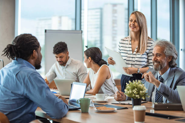 istock Team of professionals discussing over new business project 1356166902