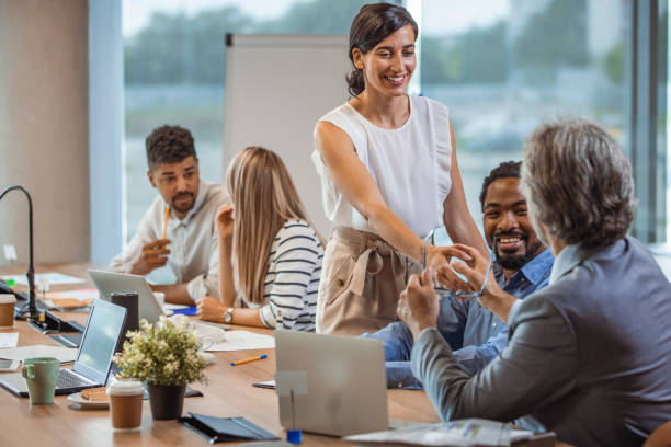 istock Standing business meeting. 1356166933