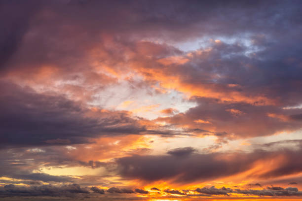 istock A sunset sky with soft orange and pink colors 1356166998