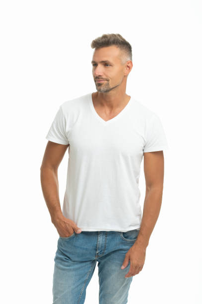 istock Serious handsome man in casual tshirt keep hand in pocket isolated on white, dude 1356170666