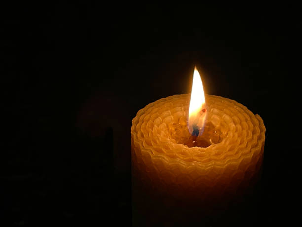 istock A wax candle burning in the dark 1356171354