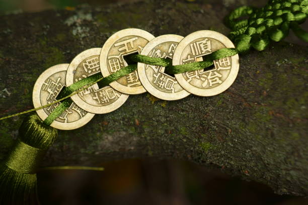 A bunch of Chinese coins in close-up. A bunch of Chinese coins in close-up. A symbol of prosperity and wealth. Green shade. chinese yuan coin stock pictures, royalty-free photos & images