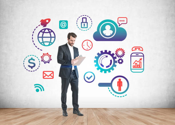 istock Man with clipboard and business strategy sketch 1356175761