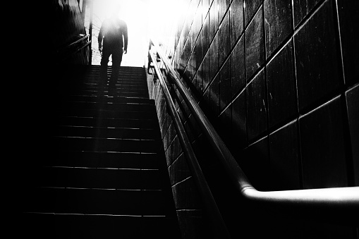 Image of silhouette of a man climbing stairs