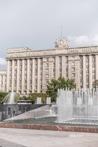 Urban landscape of public space on Moskovskaya square. Fountains and the House of Soviets. Saint-Petersburg, Russia, 26 August 2020: Urban landscape of public space on Moskovskaya square. Fountains and the House of Soviets. moskovskaya stock pictures, royalty-free photos & images