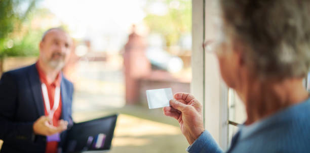 istock salesman at the door 1356179576
