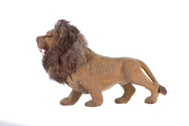 istock toy lion isolated on white background 1356181517