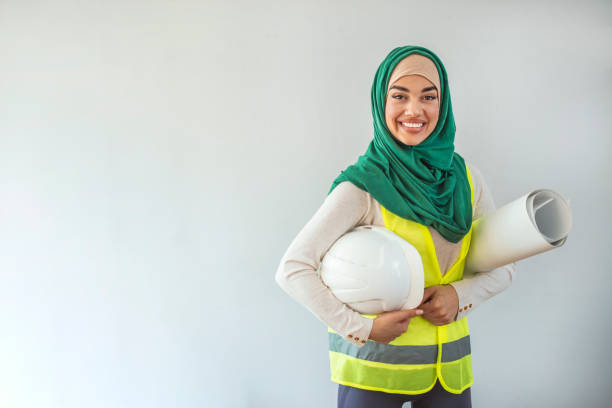 istock Young Muslim contractor woman wearing a protective helmet 1356181886