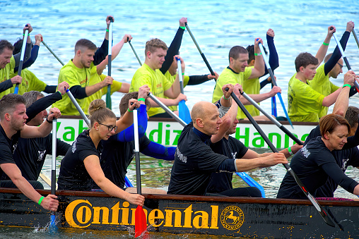 Hanover, Germany, May 19, 2018: Close up of rowers on Maschsee lake during dragon boat race