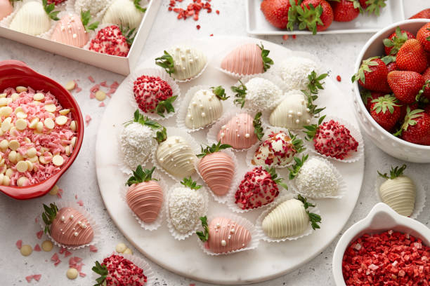 istock Chocolate dipped strawberries mix on marble board 1356188301