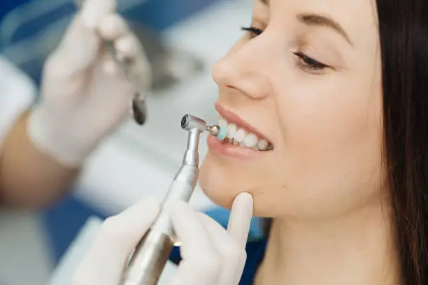 Photo of Oral hygiene, dentist doing Scaling and brushing procedure