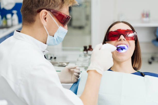 istock Young woman getting dental treatment. 1356189771