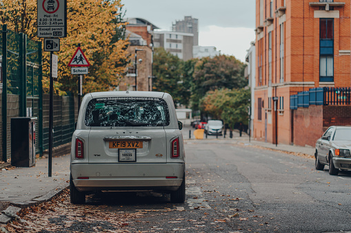 London, United Kingdom - August 31, 2019: Electric LEVC cab on a street in Islington, London. Cabs and taxis are an important part of the capital's transport system.