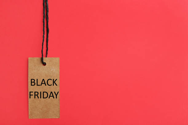 istock Tag with words BLACK FRIDAY on red background, top view. Space for text 1356190121