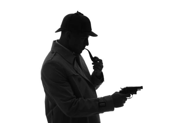 istock Old fashioned detective with smoking pipe and revolver on white background 1356191006
