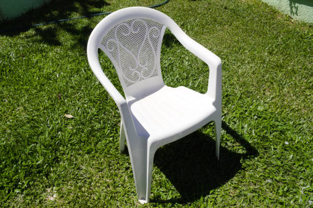 istock Garden chair with green lawn 1356192078