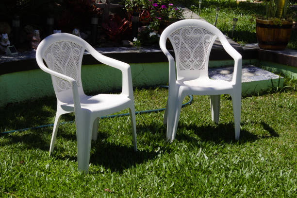 istock Garden chair with green lawn 1356192194