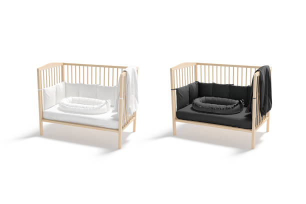 istock Blank wood cot with black, white crib and nest mockup 1356192248