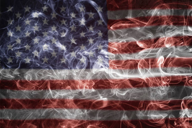 istock The American Flag Over A Smoke Pattern 1356193763
