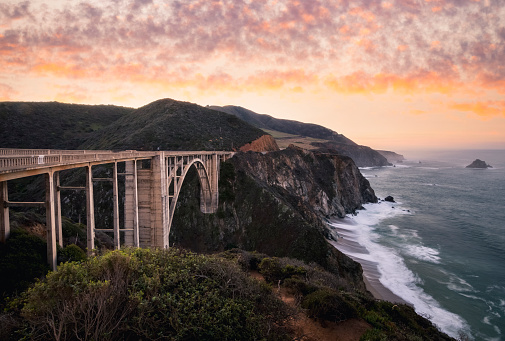 Paxific coast Highway in Monterey southern region, Northern California, USA. Sunrise over Bixby bridge.