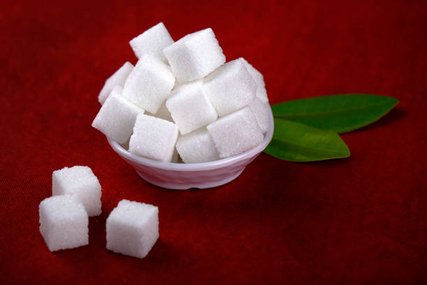 istock Sugar cubes. Cube sugar background, Sugar cubes in white bowl, isolated on white background. 1356195003
