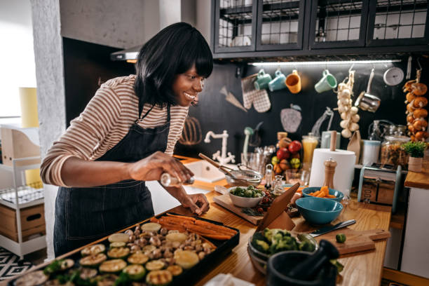 istock Woman watching recipe in digital tablet 1356199492